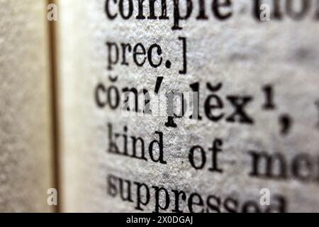 Word complex on dictionary page, macro close-up Stock Photo