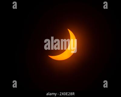 The Solar Eclipse 2024, the sun partially blocked by the Moon. Central Texas, USA. Stock Photo