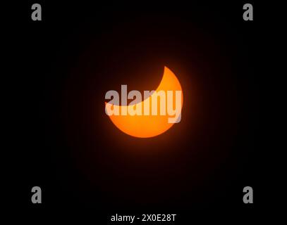 The Solar Eclipse 2024, the sun partially blocked by the Moon. Central Texas, USA. Stock Photo