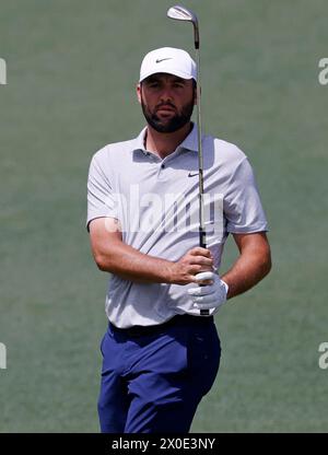 Augusta, United States. 11th Apr, 2024. Scottie Scheffler watches his an approach shot on the second hole during the first round of the Masters Tournament at Augusta National Golf Club in Augusta, Georgia on Thursday, April 11, 2024. Photo by Tannen Maury/UPI Credit: UPI/Alamy Live News Stock Photo