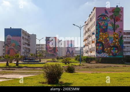 Casablanca, Morocco - January 20 2019: Buildings in El Hank district with four of them decorated with murals by famous street artists. From left to ri Stock Photo