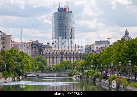 Bucharest, Romania - June 24 2018: Bridge crossing the Dambovita River with the General Inspectorate of Romanian Police and the Bucharest Financial Pl Stock Photo