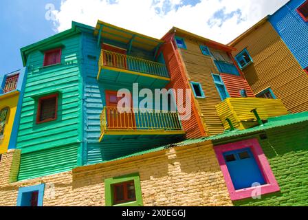 colorful buildings line the pedestrian street, La Caminito containing artists, tango dancers  and cafes in the neighborhood of La Boca - Buenos Aires, Stock Photo