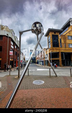 The Martian statue in the town centre of Woking, a town in Surrey, England, from the H G Wells novel 'War of the Worlds' set in nearby Horsell Common Stock Photo