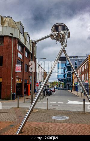 The Martian statue in the town centre of Woking, a town in Surrey, England, from the H G Wells novel 'War of the Worlds' set in nearby Horsell Common Stock Photo