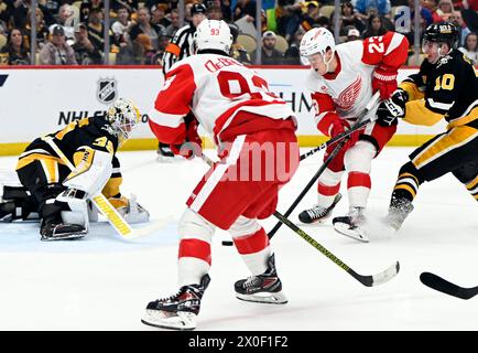 Pittsburgh, United States. 11th Apr, 2024. Detroit Red Wings left wing Lucas Raymond (23) scores his second goal of the first period against the Pittsburgh Penguins at PPG Paints Arena in Pittsburgh on Thursday, April 11, 2024. Photo by Archie Carpenter/UPI. Credit: UPI/Alamy Live News Stock Photo