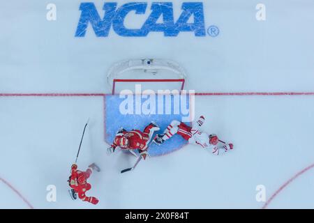 Boston University forward Luke Tuch (11) shoots before the start of an ...