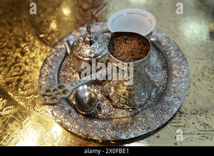 Bosanska kahva / Bosnian coffee served in a traditional Dzezva pot. Stock Photo