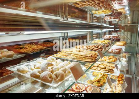 Delectable Assortment of Pastries and Sweets on Display at a Bakery Shop Stock Photo