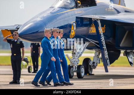 April 07, 2024: Officers of the U. S. Navy Flight Demonstration Squadron Blue Angels (L-R) #6 Commander Thomas Zimmerman, #5 Lieutenant Commander Griffin Stangel and #4 Lieutenant Commander Amanda Lee walk to their Boeing F/A-18 Super Hornet aircraft in preperation of their aerobatic demonstration at the Beyond The Horizon Air and Space Show at Maxwell Air Force Base in Montgomery, Alabama. Mike Wulf/CSM (Credit Image: © Mike wulf/Cal Sport Media) Stock Photo