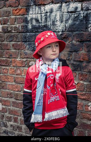 Young Liverpool FC supporter at Anfield , Liverpool . Stock Photo