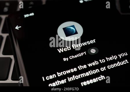 WEB BROWSER custom GPT seen in GPT Store on the screen of smartphone placed on laptop keyboad. Stafford, United Kingdom, April 8, 2024 Stock Photo