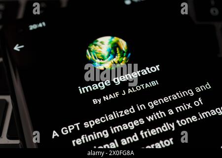 IMAGE GENERATOR custom GPT seen in GPT Store on the screen of smartphone placed on laptop keyboad. Stafford, United Kingdom, April 8, 2024 Stock Photo