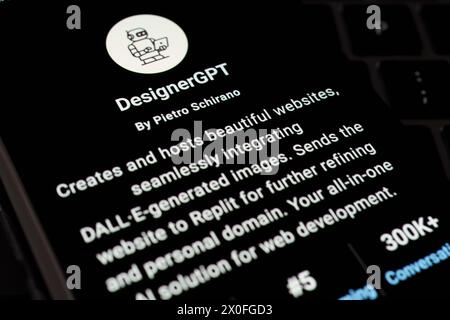 DESIGNERGPT custom GPT seen in GPT Store on the screen of smartphone placed on laptop keyboad. Stafford, United Kingdom, April 8, 2024 Stock Photo