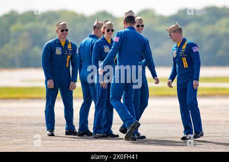 April 07, 2024: Officers of the U. S. Navy Flight Demonstration Squadron Blue Angels (L-R) #6 Commander Thomas Zimmerman, #5 Lieutenant Commander Griffin Stangel, #4 Lieutenant Commander Amanda Lee, #1 Commander Alexander P. Armatas, #3 Lieutenant James Wesley Perkins and #2 Lieutenant Commander Jack Keilty relax after completing their aerobatic demonstration at the Beyond The Horizon Air and Space Show at Maxwell Air Force Base in Montgomery, Alabama. Mike Wulf/CSM Stock Photo