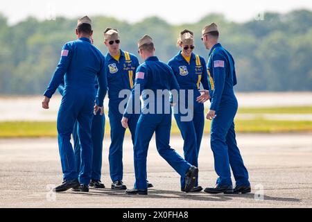 April 07, 2024: Officers of the U. S. Navy Flight Demonstration Squadron Blue Angels (L-R) #1 Commander Alexander P. Armatas, #6 Commander Thomas Zimmerman (hidden), #5 Lieutenant Commander Griffin Stangel, #2 Lieutenant Commander Jack Keilty, #4 Lieutenant Commander Amanda Lee and #3 Lieutenant James Wesley Perkins relax after completing their aerobatic demonstration at the Beyond The Horizon Air and Space Show at Maxwell Air Force Base in Montgomery, Alabama. Mike Wulf/CSM (Credit Image: © Mike wulf/Cal Sport Media) Stock Photo