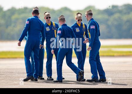 April 07, 2024: Officers of the U. S. Navy Flight Demonstration Squadron Blue Angels (L-R) #1 Commander Alexander P. Armatas, #6 Commander Thomas Zimmerman (hidden), #5 Lieutenant Commander Griffin Stangel, #2 Lieutenant Commander Jack Keilty, #4 Lieutenant Commander Amanda Lee and #3 Lieutenant James Wesley Perkins relax after completing their aerobatic demonstration at the Beyond The Horizon Air and Space Show at Maxwell Air Force Base in Montgomery, Alabama. Mike Wulf/CSM Stock Photo