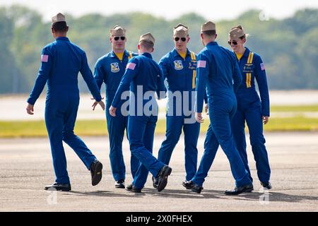 April 07, 2024: Officers of the U. S. Navy Flight Demonstration Squadron Blue Angels (L-R) #1 Commander Alexander P. Armatas, #6 Commander Thomas Zimmerman, #2 Lieutenant Commander Jack Keilty, #5 Lieutenant Commander Griffin Stangel, #3 Lieutenant James Wesley Perkins and #4 Lieutenant Commander Amanda Lee relax after completing their aerobatic demonstration at the Beyond The Horizon Air and Space Show at Maxwell Air Force Base in Montgomery, Alabama. Mike Wulf/CSM (Credit Image: © Mike wulf/Cal Sport Media) Stock Photo