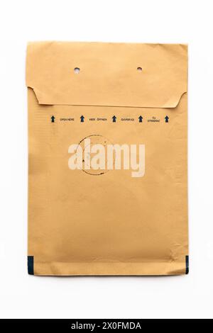 Padded envelope top view isolated on white background, cardboard bag, package paper letter. Stock Photo