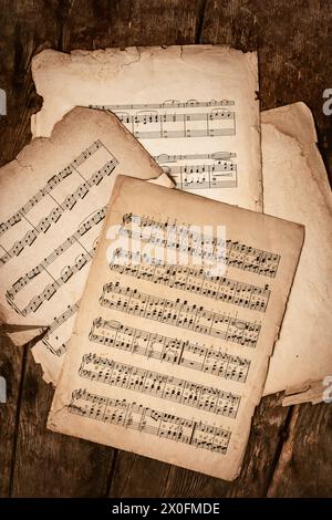 Old Music Sheets On Wooden Background Stock Photo