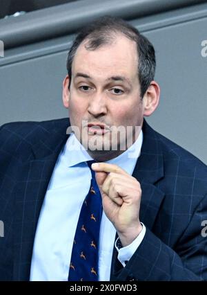 Berlin, Germany. 12th Apr, 2024. Norbert Kleinwächter (AfD) speaks during the 164th session of the Bundestag. The topic of the debate is the DÜV Adaptation Act and the Payment Card Act. Credit: Britta Pedersen/dpa/Alamy Live News Stock Photo