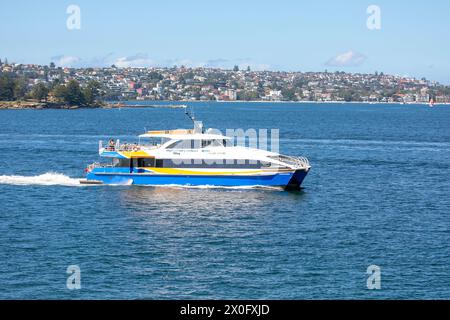 The NRMA Manly fast ferry travels between Manly Beach ferry wharf and Sydney Circular Quay ferry terminus, Sydney,Australia Stock Photo