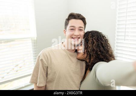 Couple taking a selfie in their home Stock Photo