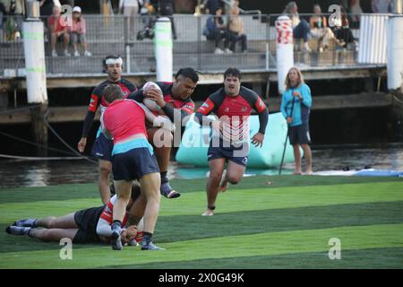 Sydney, Australia. 12th April 2024. The BSc Aqua Rugby Festival on a 30x30 metre floating pontoon at Darling Harbour. Pictured: Men's final. Credit: Richard Milnes/Alamy Stock Photo