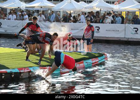 Sydney, Australia. 12th April 2024. The BSc Aqua Rugby Festival on a 30x30 metre floating pontoon at Darling Harbour. Pictured: Men's final. Credit: Richard Milnes/Alamy Stock Photo