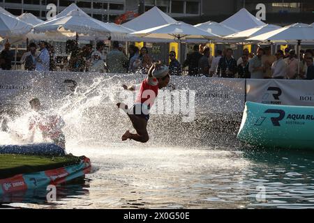 Sydney, Australia. 12th April 2024. The BSc Aqua Rugby Festival on a 30x30 metre floating pontoon at Darling Harbour. Pictured: Men's final. Credit: Richard Milnes/Alamy Stock Photo