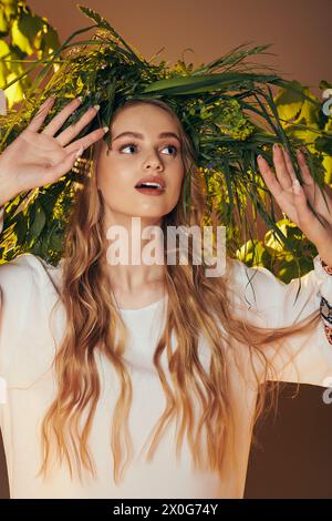 A young mavka in a traditional outfit with ornate details, radiating a fairy and fantasy aura in a studio setting. Stock Photo