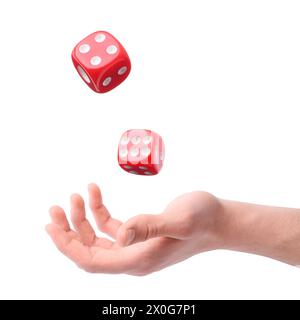 Man throwing red dice on white background, closeup Stock Photo