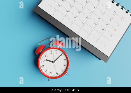 Black desk calendar and red alarm clock on blue background. Illustration of the concept of tight schedule, deadlines, due dates and workload Stock Photo