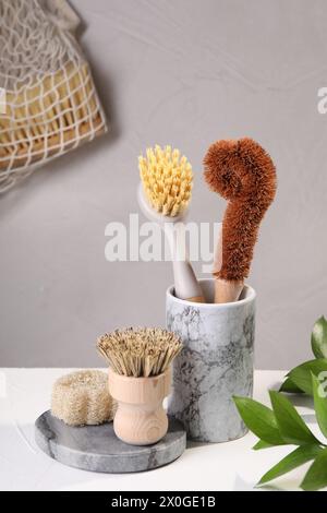 Set of cleaning brushes on white table Stock Photo