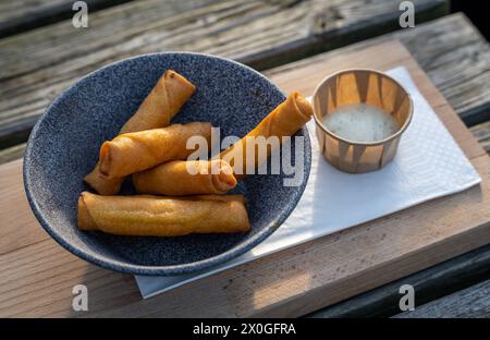 Delicious cheese spring rolls snack. Cheese sticks wrapped in a spring roll pastry and deep fried Stock Photo