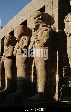 The temple of Ramses III with Osiris pillars in the courtyard, Karnak ...