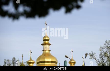 KYIV, UKRAINE - APRIL 11, 2024 - The domes of a church are pictured in Kyiv, capital of Ukraine. Stock Photo