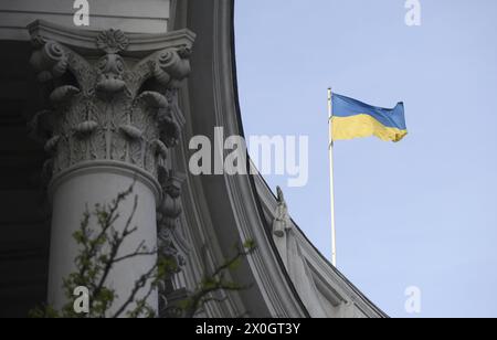 KYIV, UKRAINE - APRIL 11, 2024 - A flag of Ukraine flies over the Ukrainian Foreign Ministry building, Kyiv, capital of Ukraine. Stock Photo