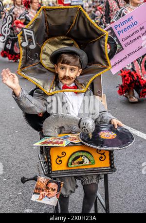 Children in very elaborate costumes in the Tenerife carnival parade 2024 Stock Photo