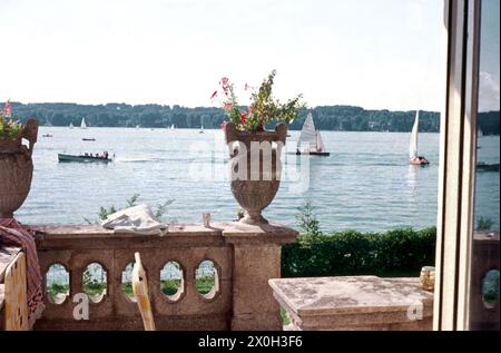 View from a veranda to the sailing boats on the Starnberger See. [automated translation] Stock Photo