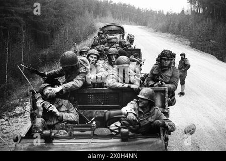 Troop exercise: Part of a convoy of vehicles waiting to continue their journey during a Bundeswehr exercise. The vehicles are full of soldiers. [automated translation] Stock Photo