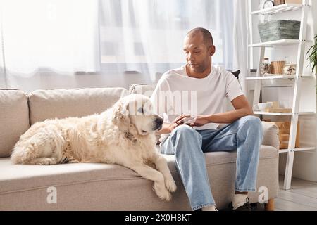 Myasthenia gravis patient and Labrador dog share a peaceful moment on the couch, embodying diversity and inclusion. Stock Photo