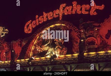 A ghost train at the Munich Oktoberfest at night. [automated translation] Stock Photo