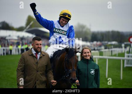 Liverpool, UK, 12th Apr, 2024. Harry Skelton celebrates after winning the 2.20 on Kateira at Aintree. Photo Credit: Paul Blake/Alamy Sports News Stock Photo