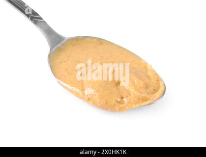 Delicious nut butter in spoon isolated on white Stock Photo