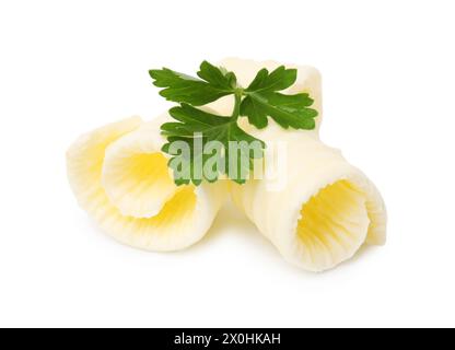 Tasty butter curls and fresh parsley isolated on white Stock Photo