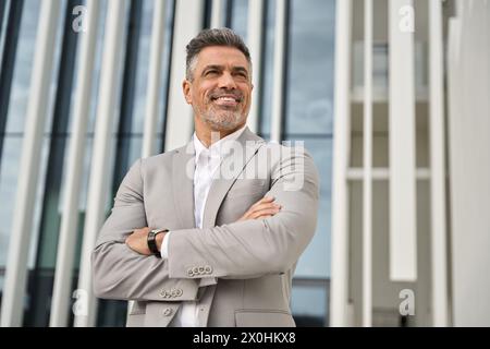 Middle aged businessman in suit looking away thinking or future success. Stock Photo