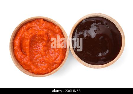 Different fresh marinades in wooden bowls isolated on white, top view Stock Photo