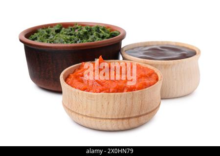 Different fresh marinades in bowls isolated on white Stock Photo