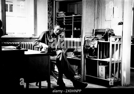 An American soldier on the phone in an office in Ochsenfurt. [automated translation] Stock Photo